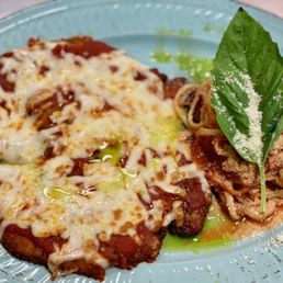 Portofino Italian Kitchen and Wine Bar signature dishes Veal Parmigiana, Rigatoni Bolognese, Shrimp Scampi.